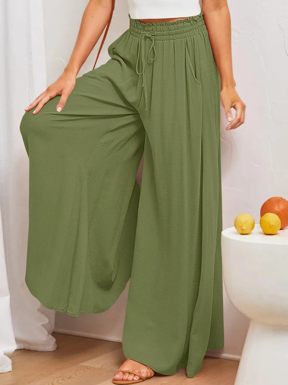 Olive-green wide-leg pants with elastic drawstring waist and side pockets
