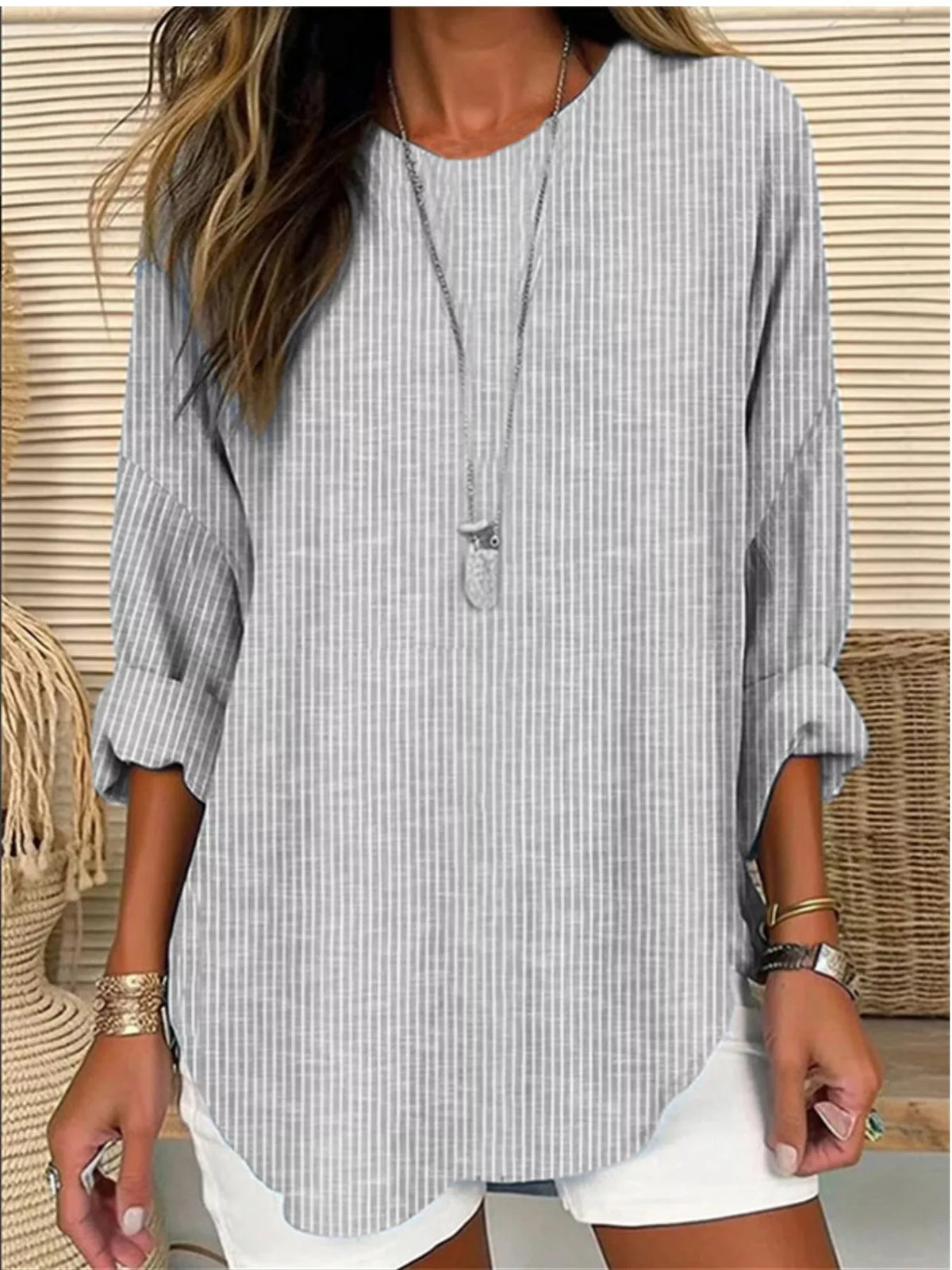 Women's striped long-sleeve blouse in light gray with split neckline