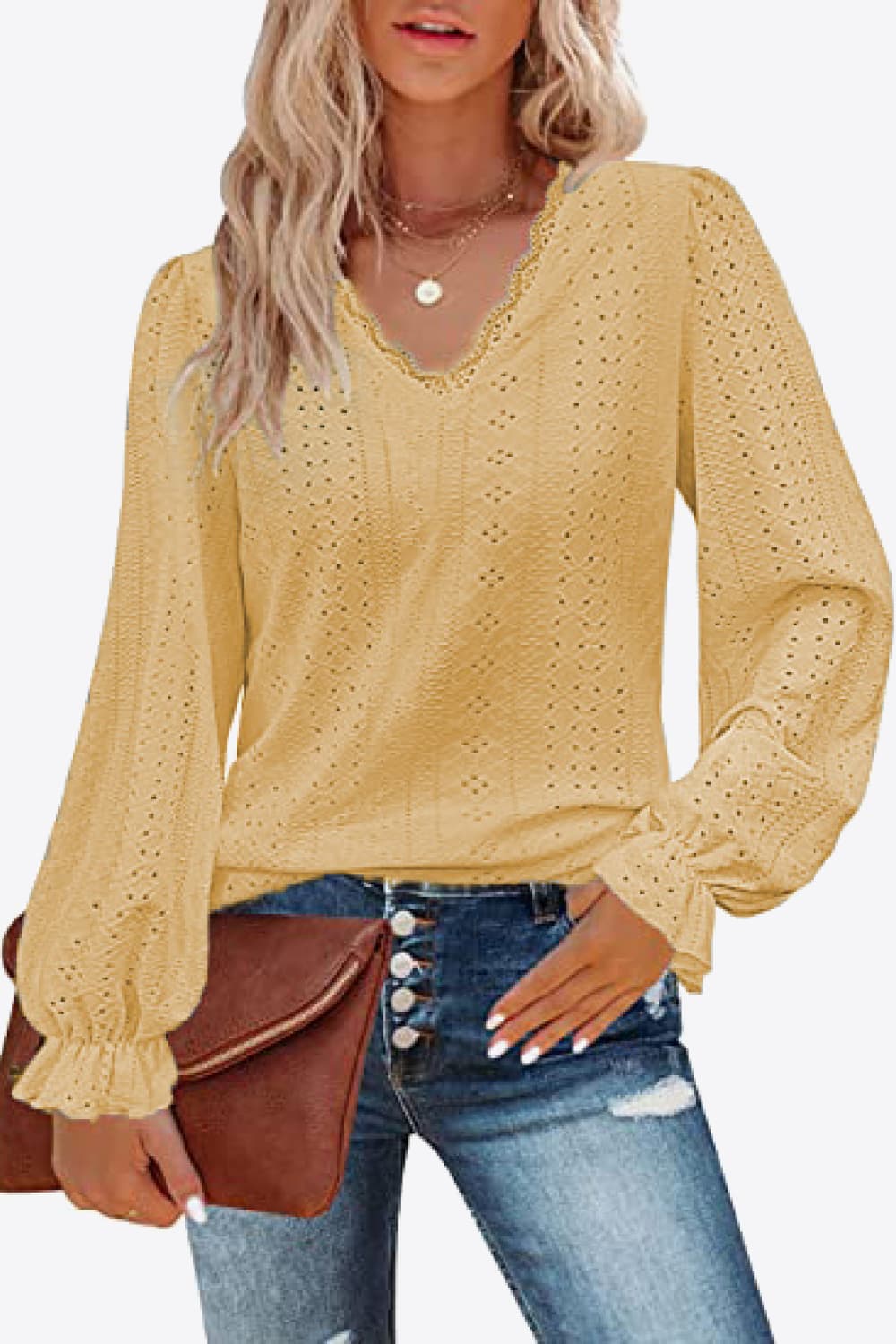 Gold eyelet V-neck blouse with long flounce sleeves