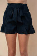 Smocked high-waisted shorts with tiered ruffles and bow tie, dark navy