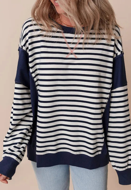 Striped long sleeve sweatshirt with exposed seam, navy and white stripes with ribbed hem