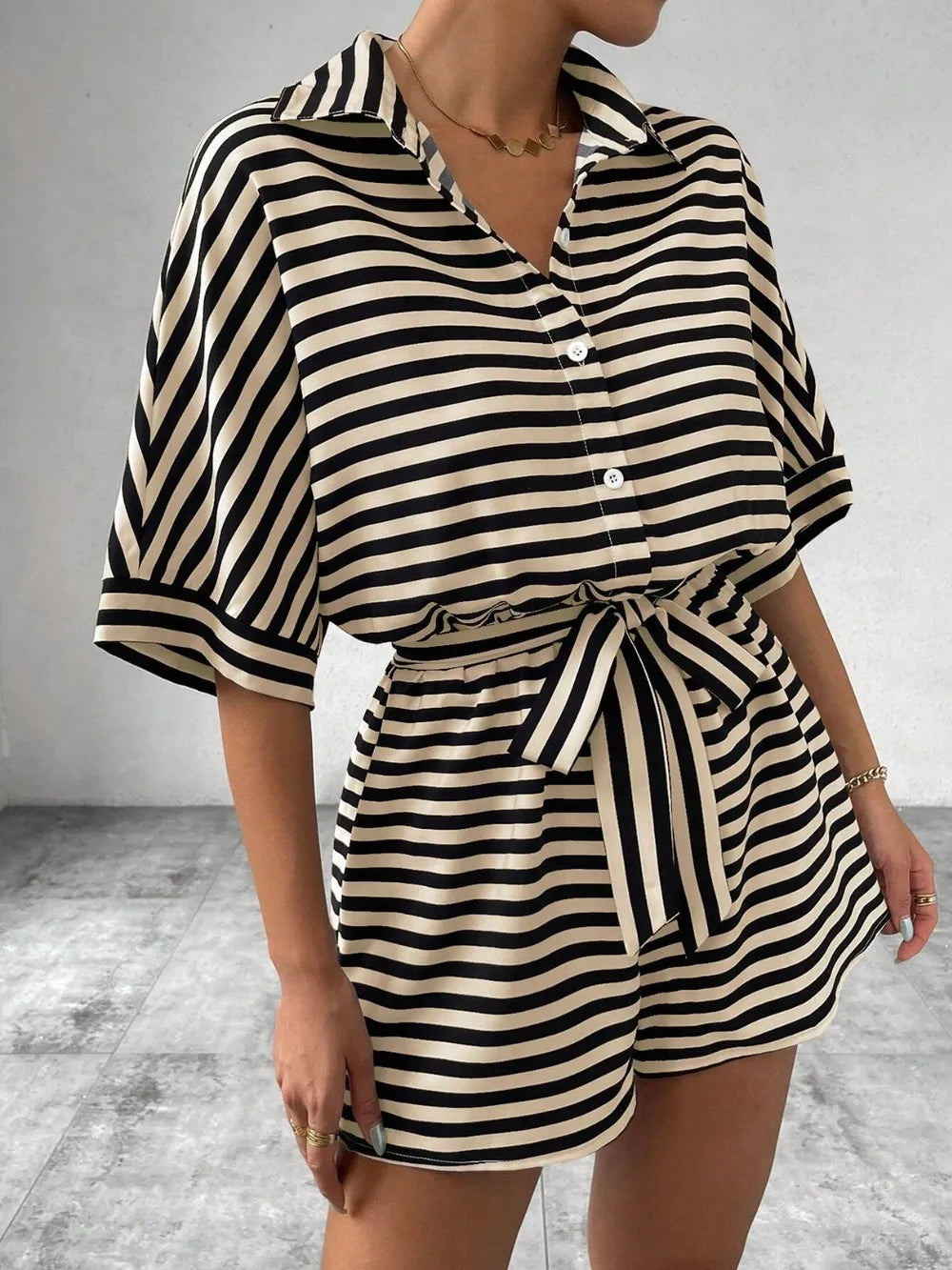 Striped tie-waist romper with button placket, belted waist tie, short puff sleeves, black/white