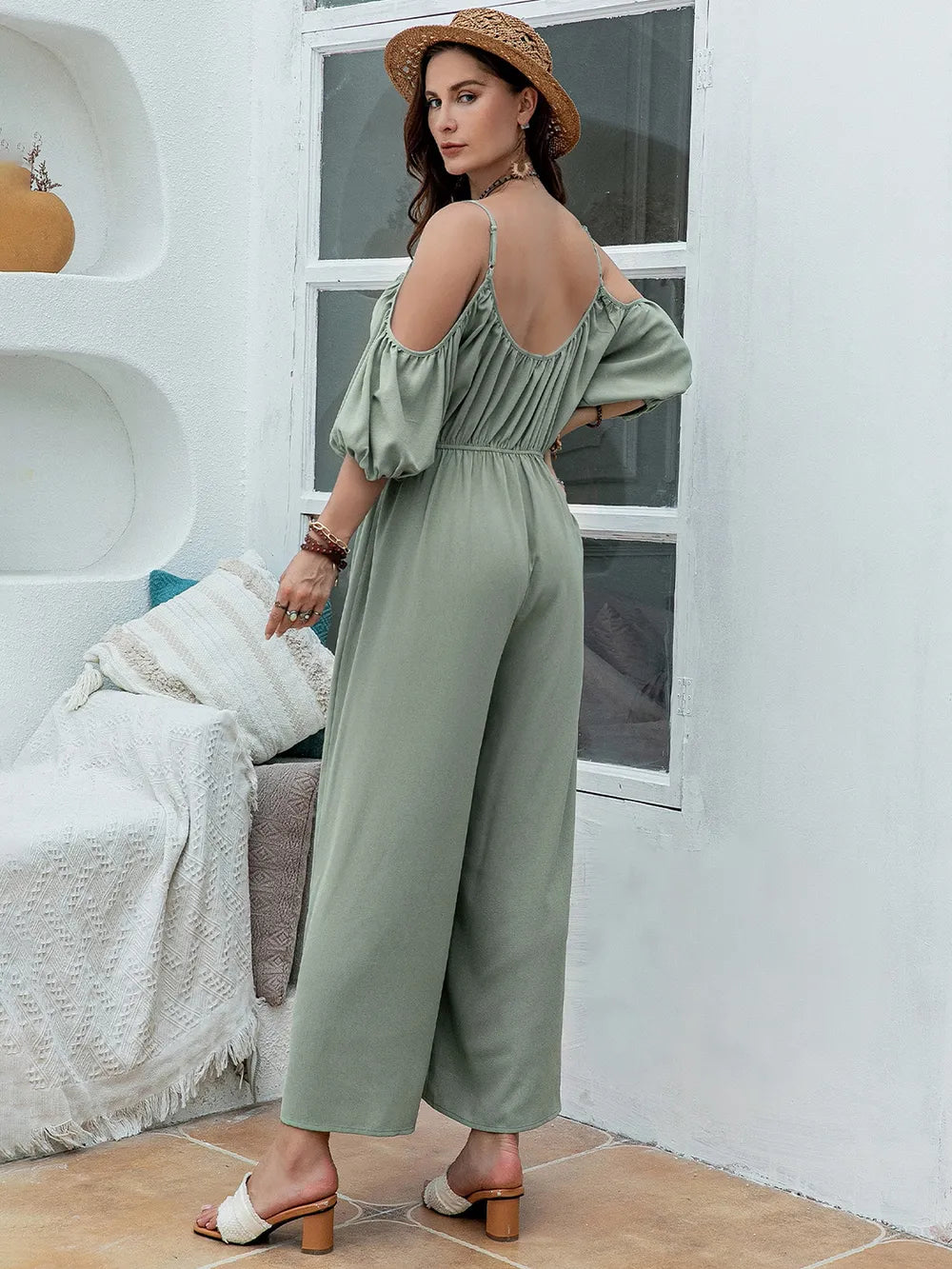 Sage green wide-leg jumpsuit with spaghetti straps and elastic waist, off-shoulder puff sleeves