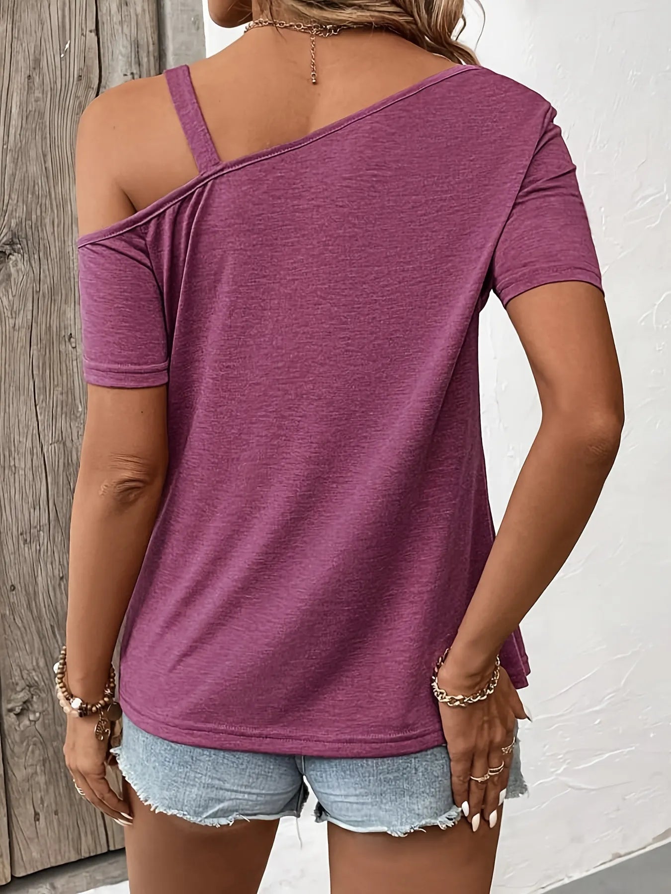 Cedar & Moore Asymmetric shoulder T-shirt with metal buckle detail in mauve, back view