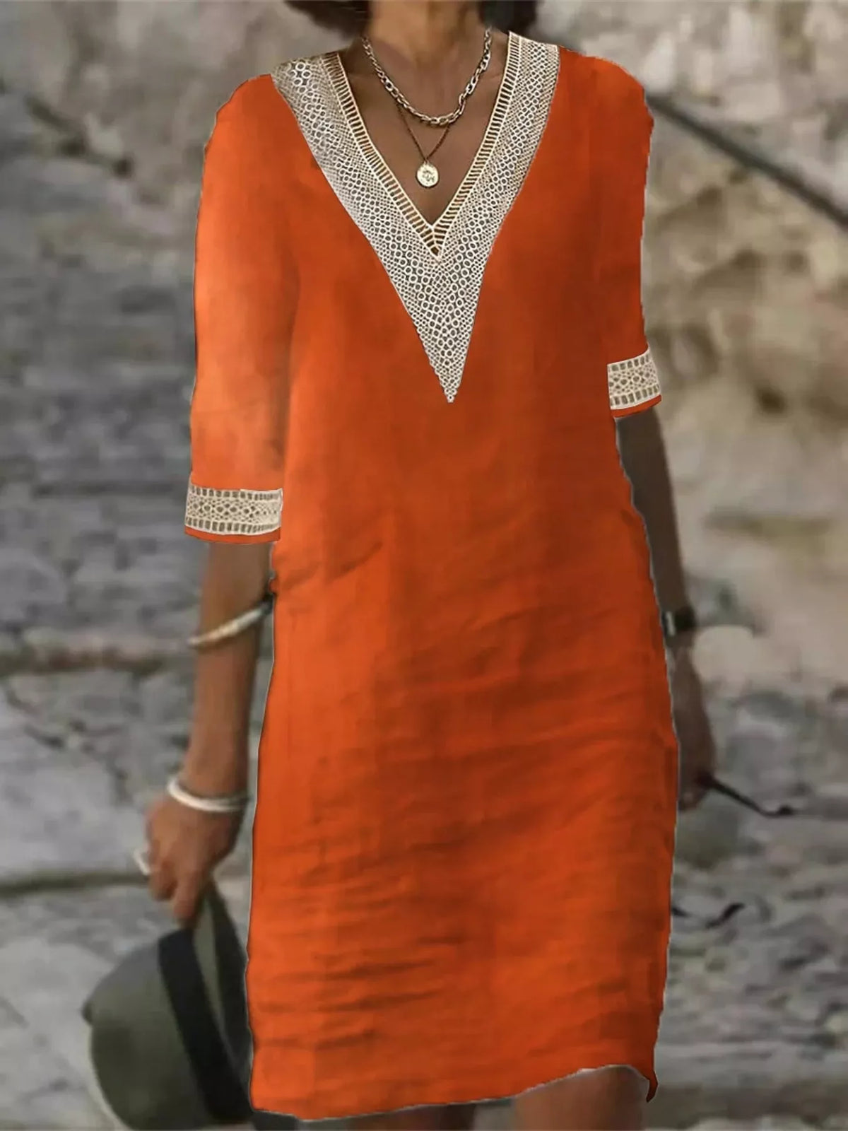 Orange-red V-neck lace-trim half-sleeve dress with textured lace neckline and cuffs