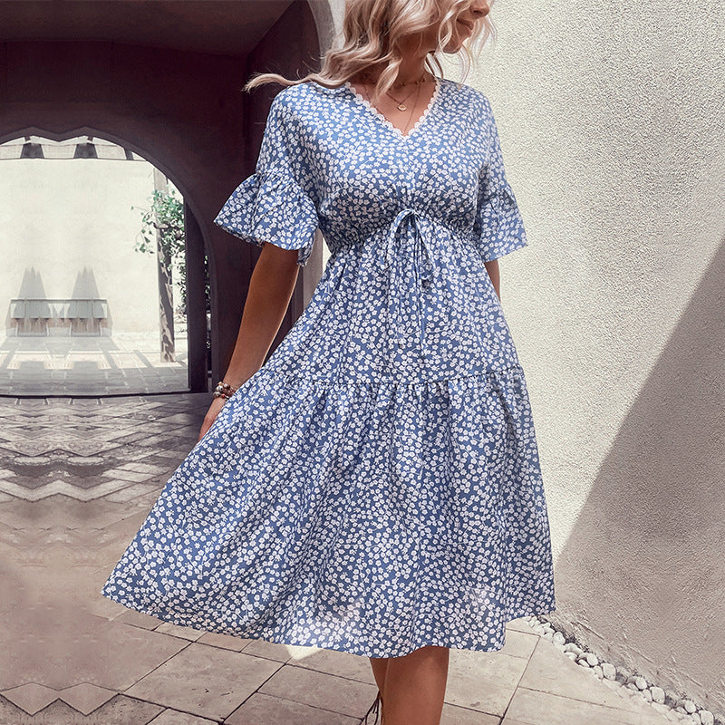 Light blue floral v-neck dress with flounce sleeves and tied waist