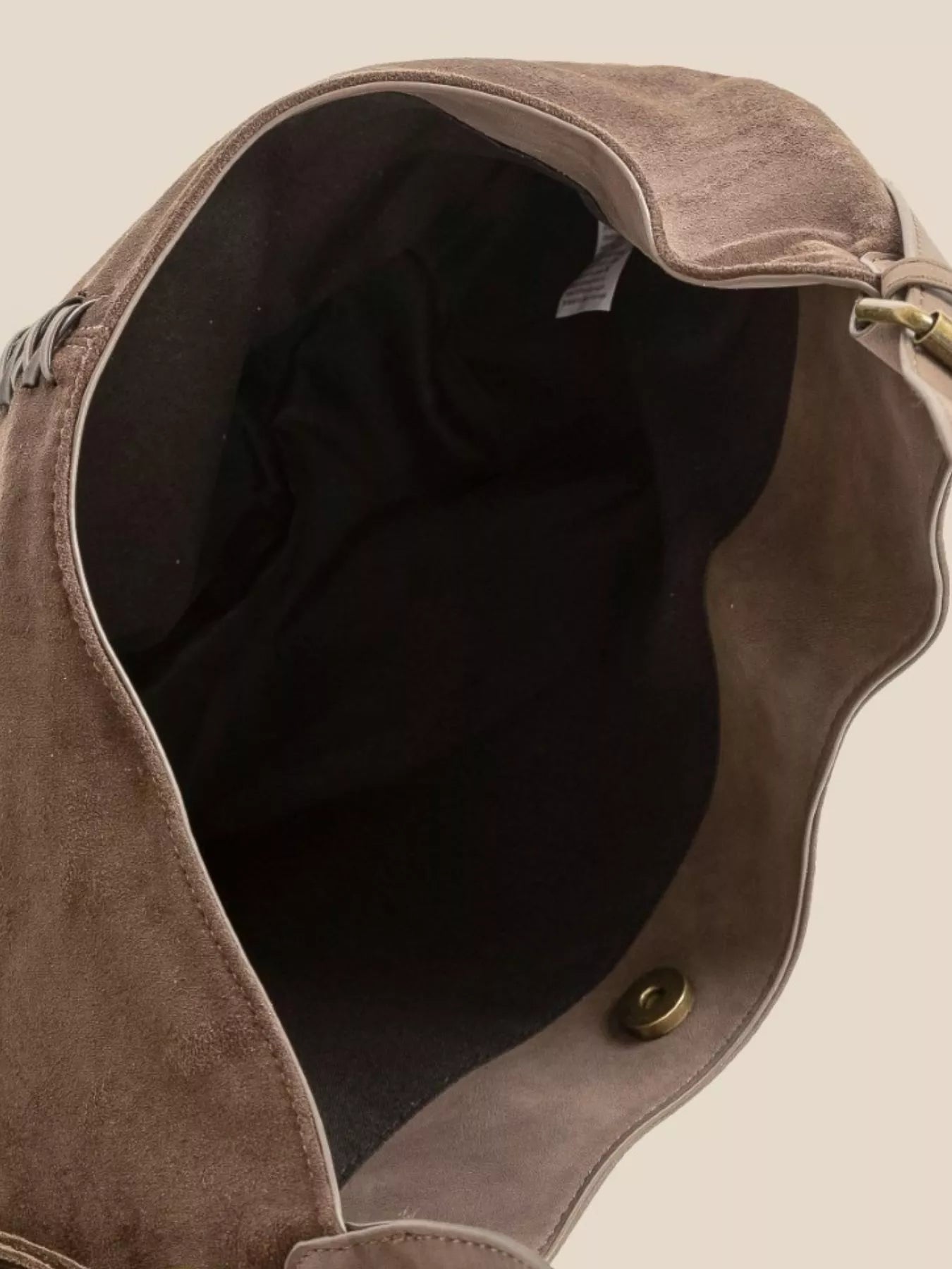 Brown suede hobo shoulder bag interior view with curved opening and snap button