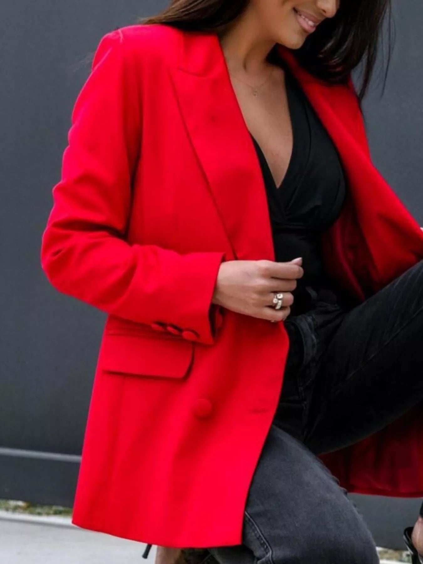 Red long-sleeve blazer with notched lapels and buttoned cuff detail