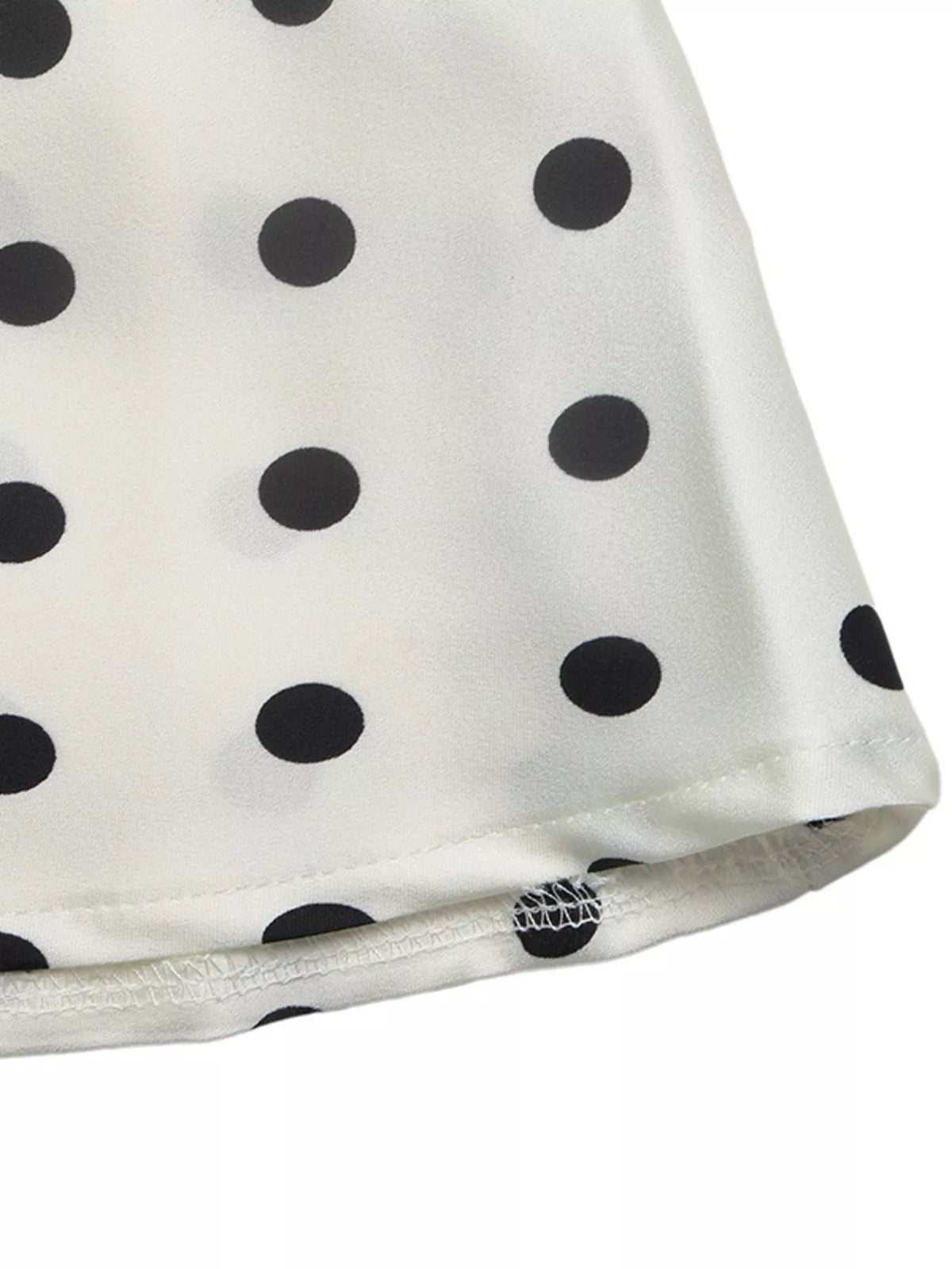Light beige midi skirt with black polka dots, stitched hem detail