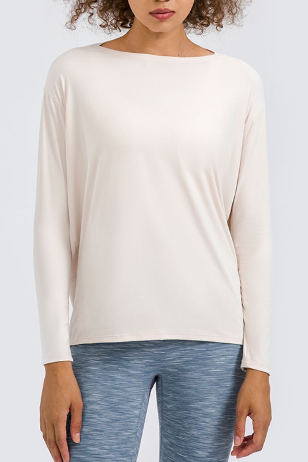 Cream loose fit active top, long sleeves with crew neckline