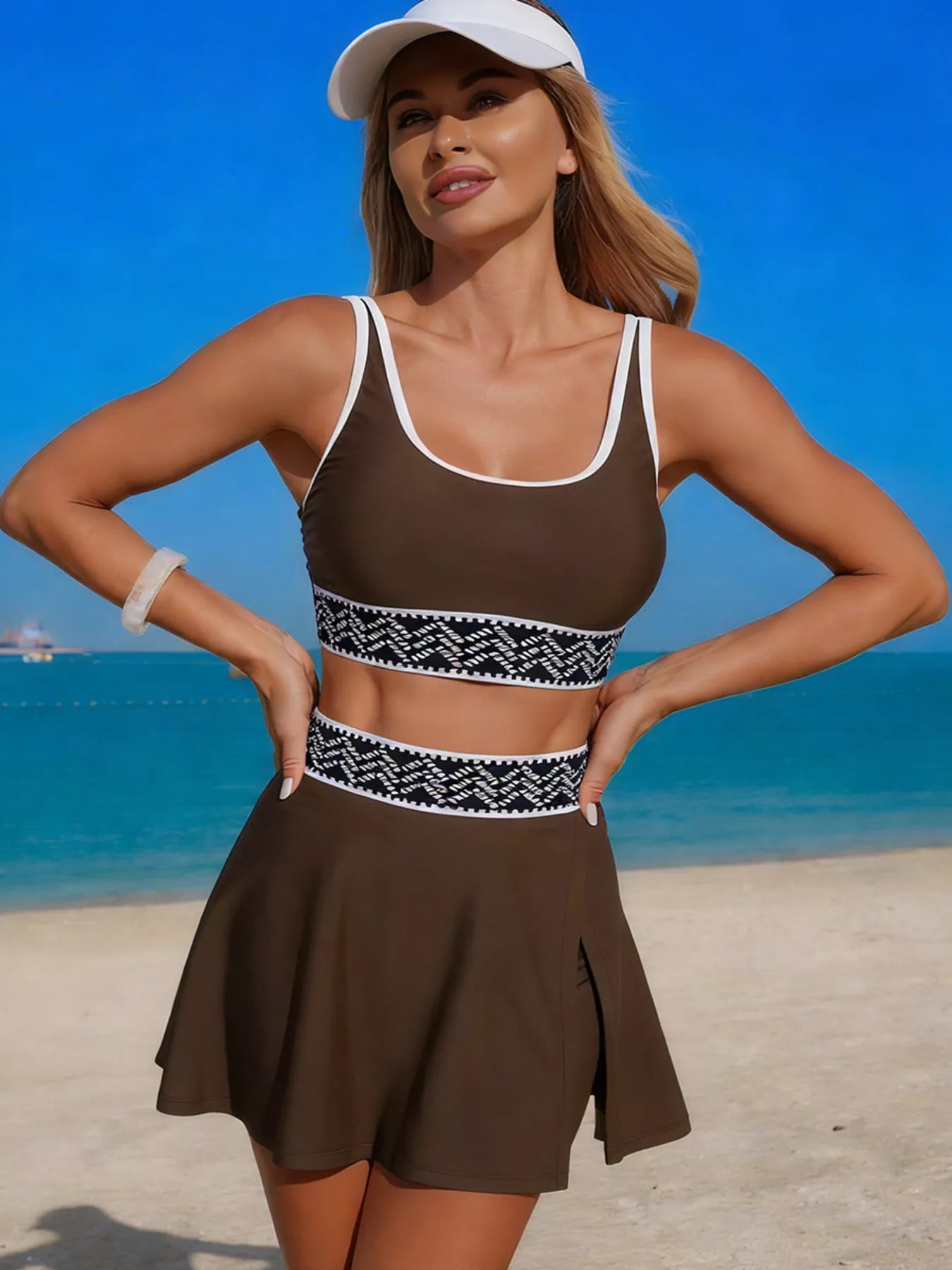 Contrast-trim tank and skort swim set in brown with white trim and patterned waistband.