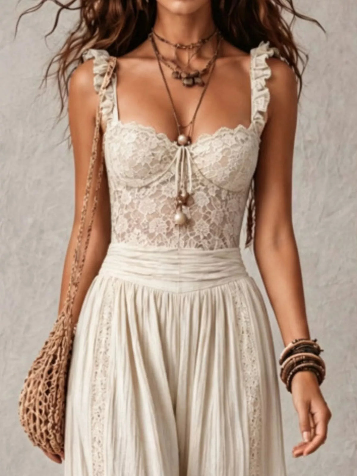 Cream lace corset jumpsuit with tie-front detail and billowy harem pant silhouette