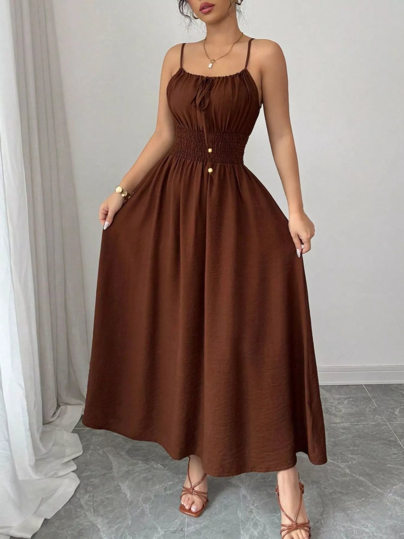 Smocked midi dress with spaghetti straps in brown, ruched bodice and buttoned front