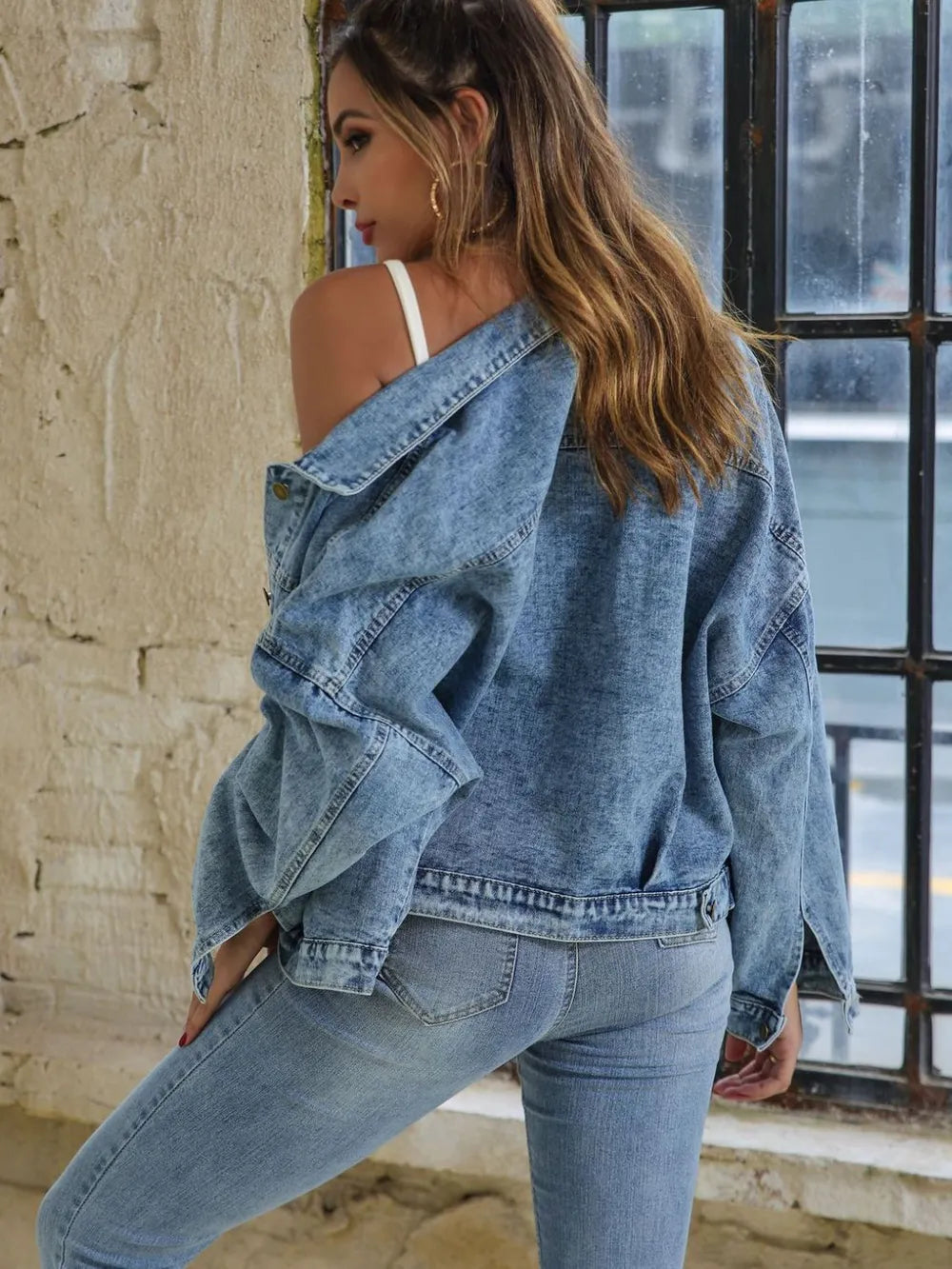 Light-wash denim drop-shoulder button jacket, side/back view with yoke detail