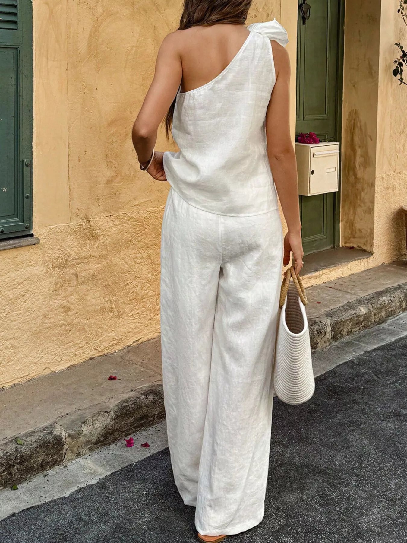White one-shoulder top and wide-leg pants set, back view with shoulder detail