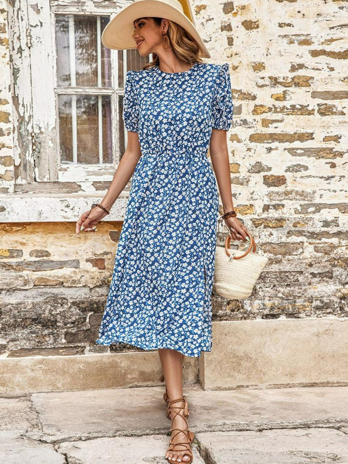 Blue floral midi dress with round neck and short puff sleeves, full length view