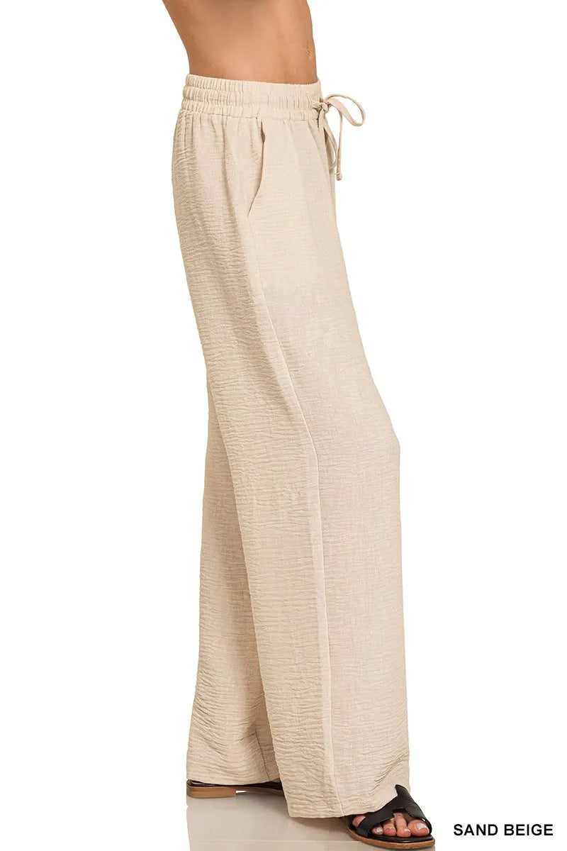 Zenana woven crepe elastic band pants in sand beige, side view, wide-leg