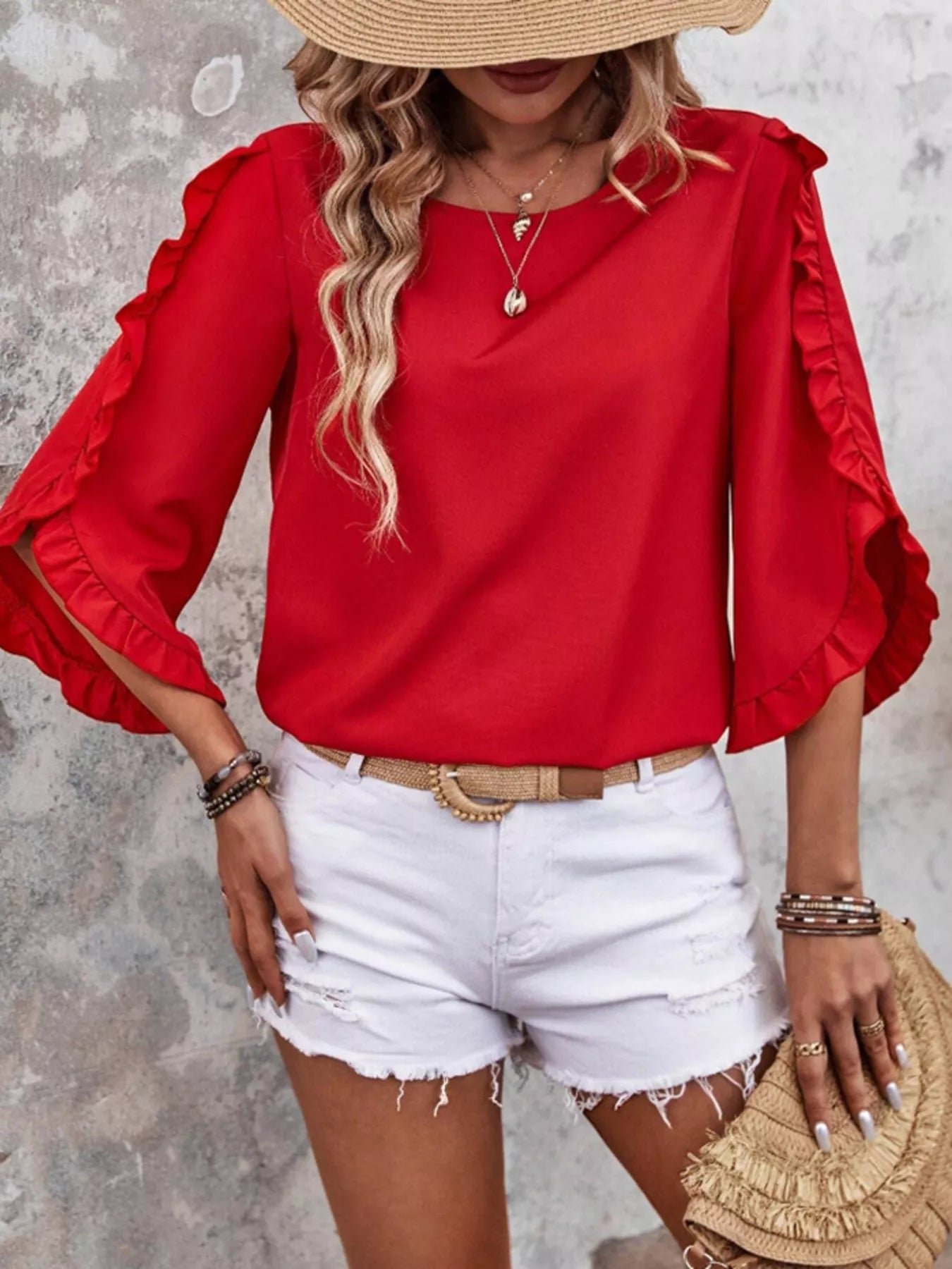 Ruffle Sleeve Solid Color Blouse in red with buttoned, ruffled sleeves, shown with white denim shorts