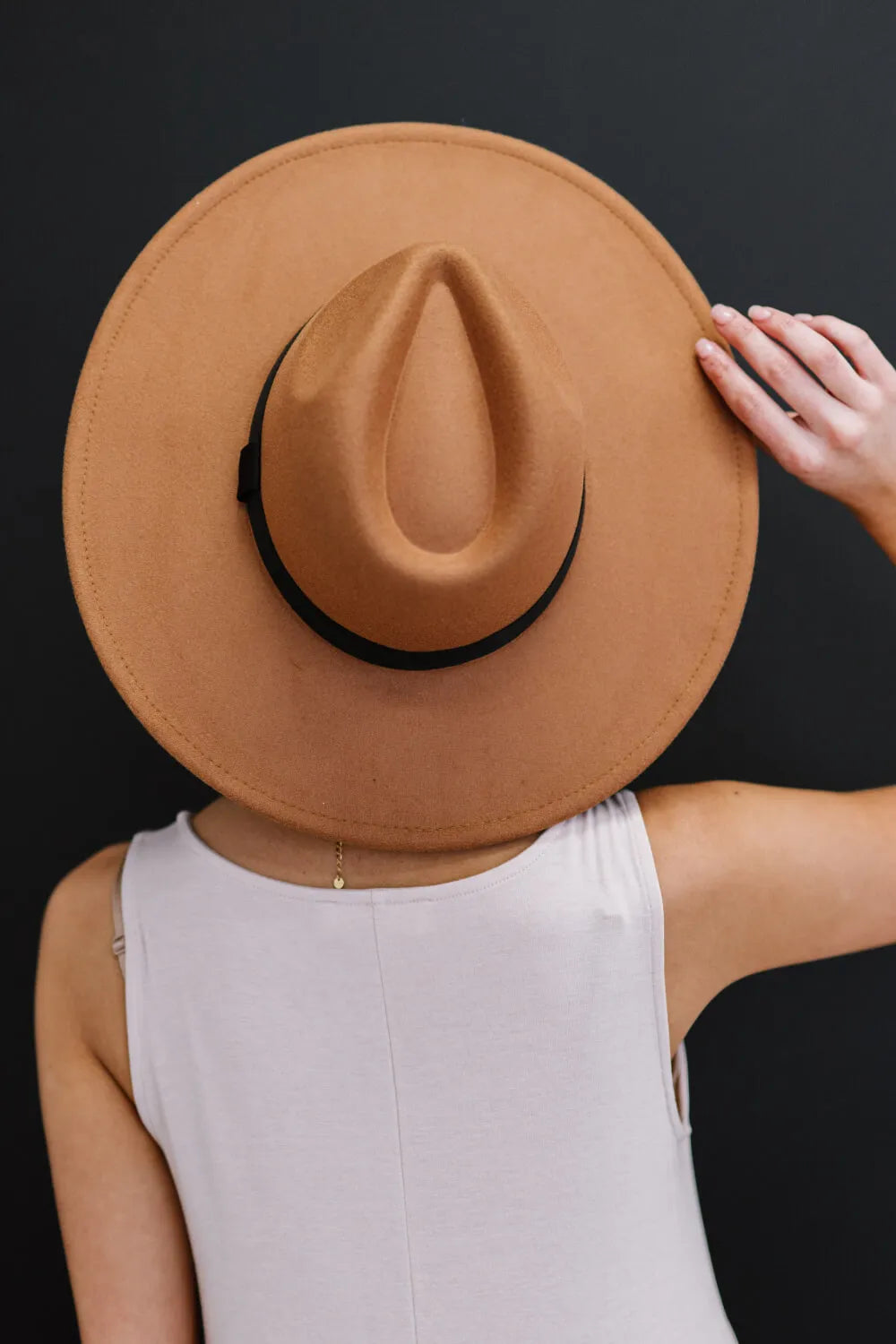 Khaki fedora hat with black ribbon band, back view