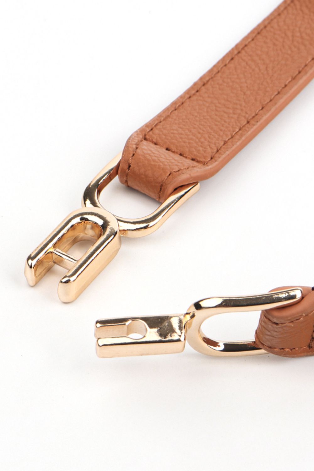 Caramel leather-look belt strap with gold-tone prong buckle hardware