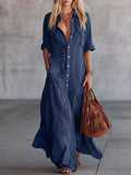Dark blue maxi shirt dress with button front, short sleeves, and side pockets