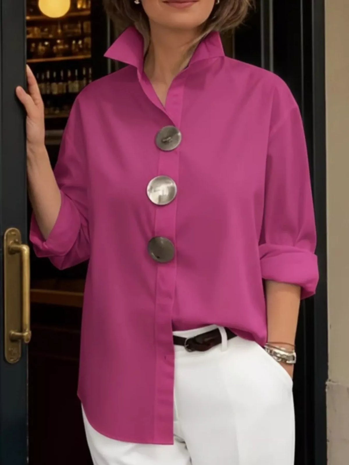 Pink oversized long-sleeve button shirt with metallic round buttons and point collar