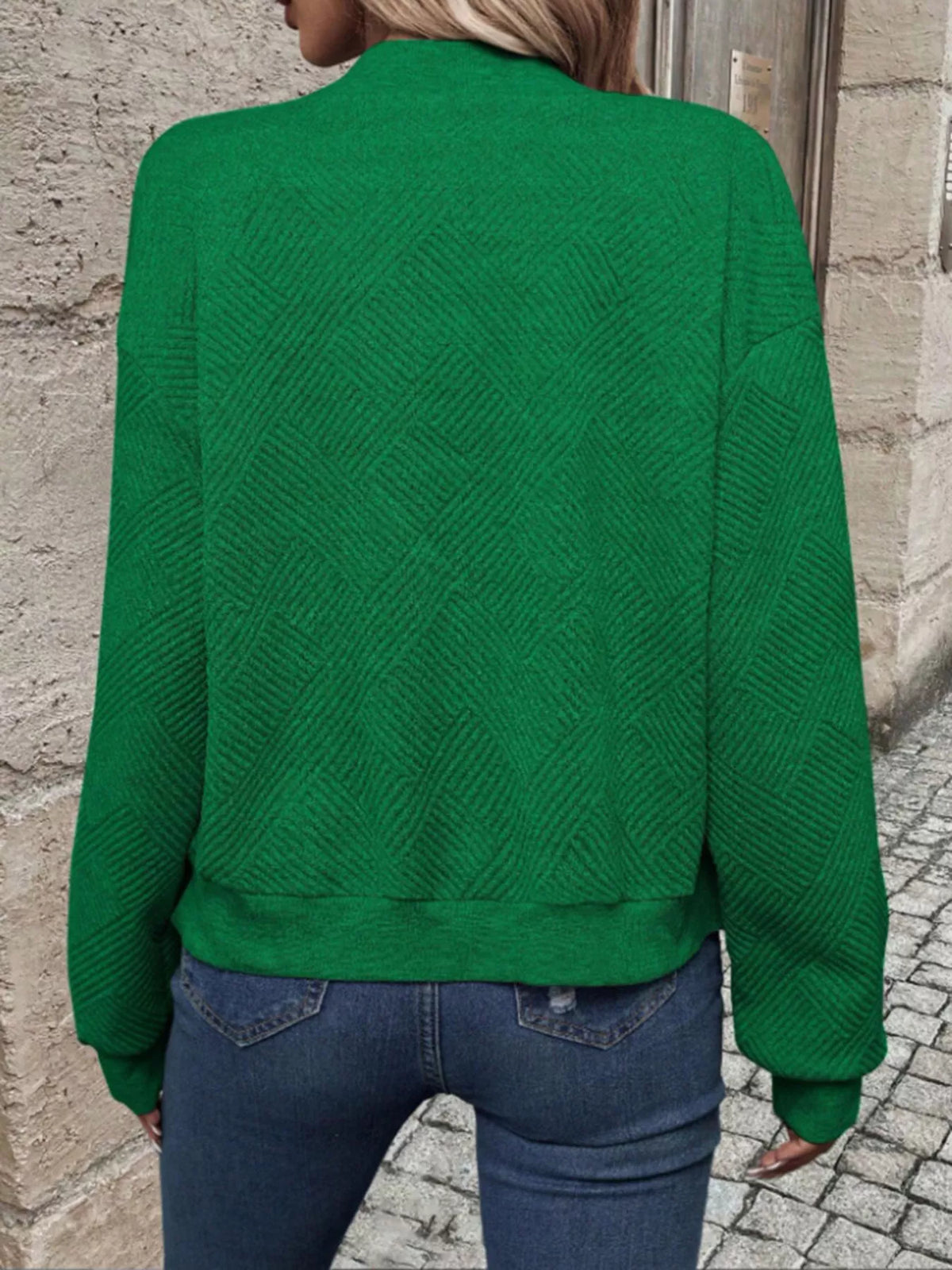 Green textured knit zip-up bomber jacket shown from back with ribbed cuffs