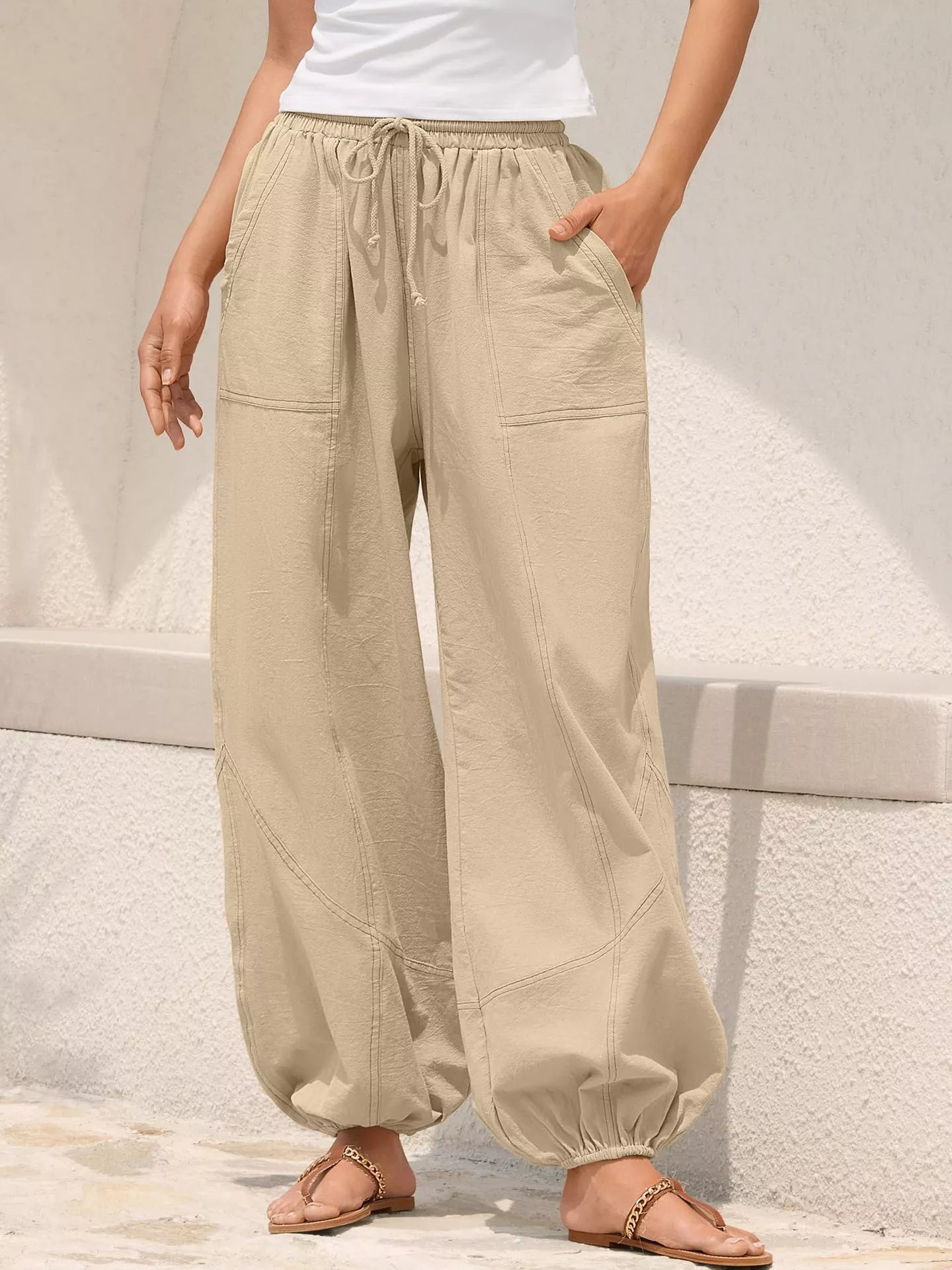 Apricot-beige harem joggers with drawstring waist, side pockets, roomy wide legs