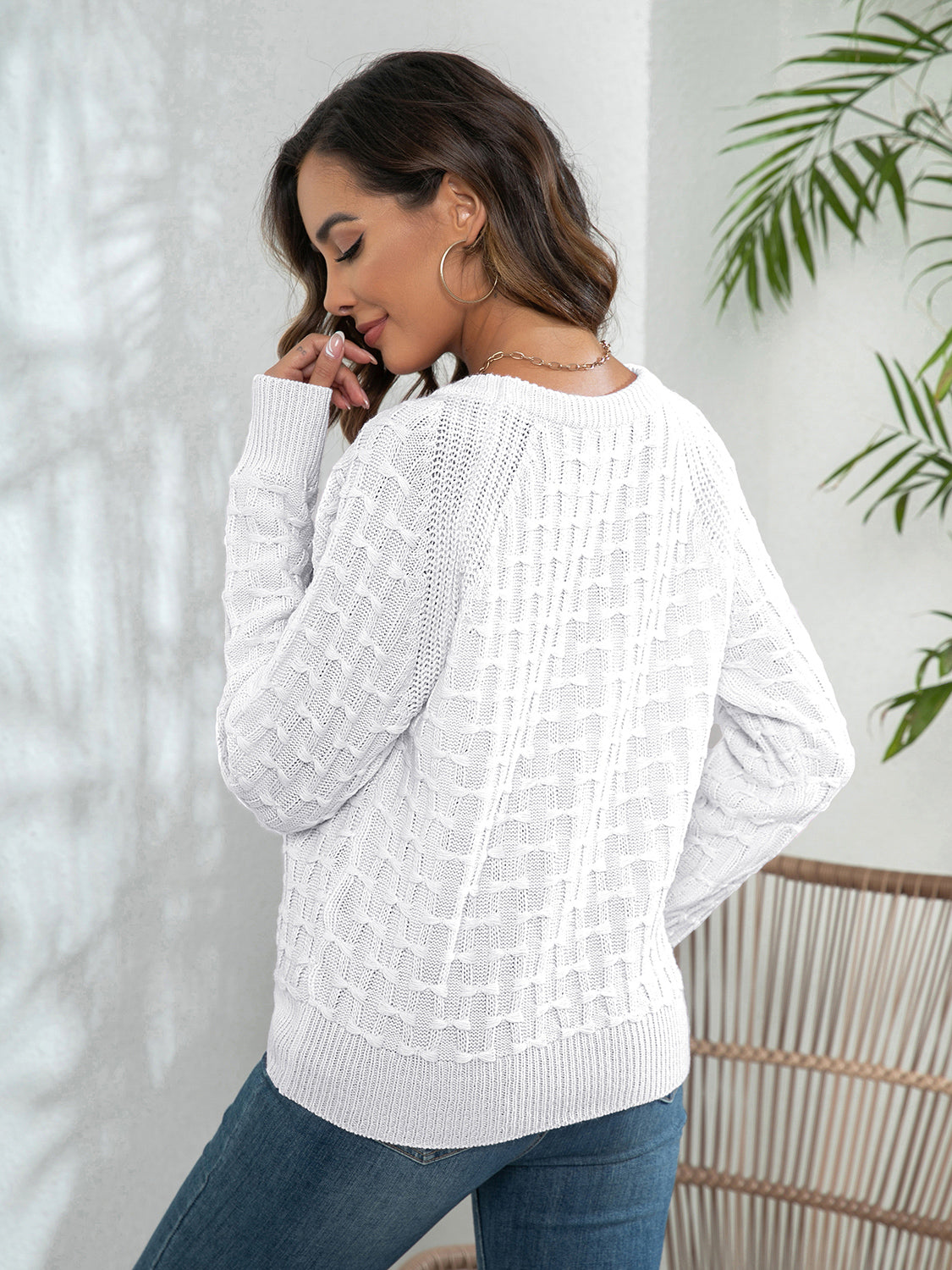 White long-sleeve sweater with textured knit and crewneck