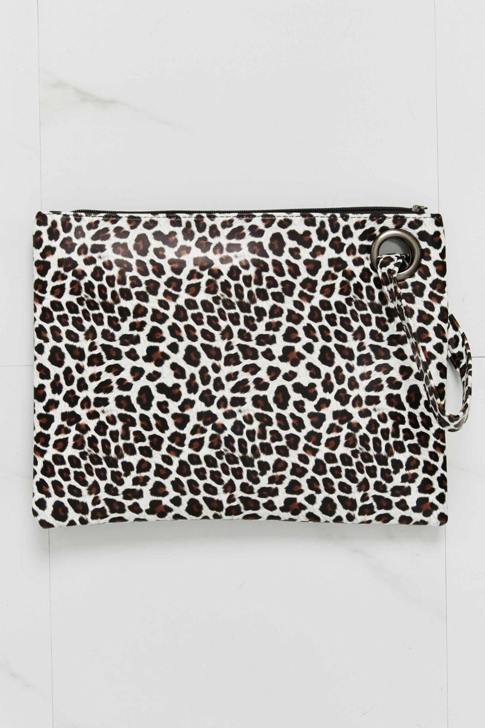 Leopard-print wristlet in brown and cream with metal zipper and wrist strap ring