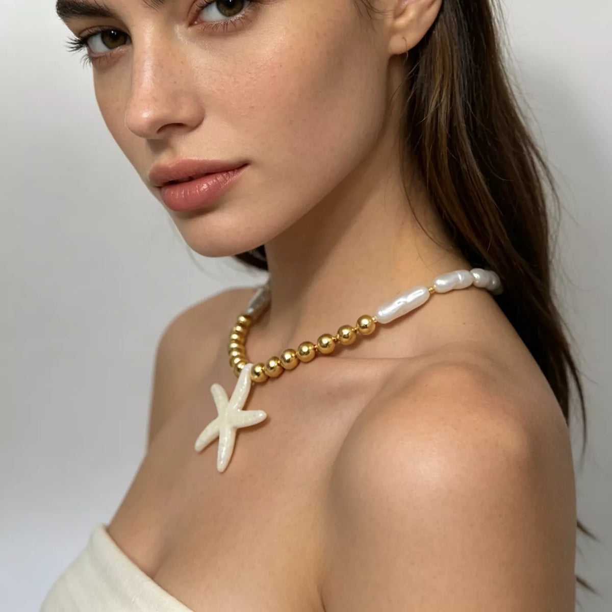 Starfish pendant necklace with pearl-look beads and gold-tone bead accents