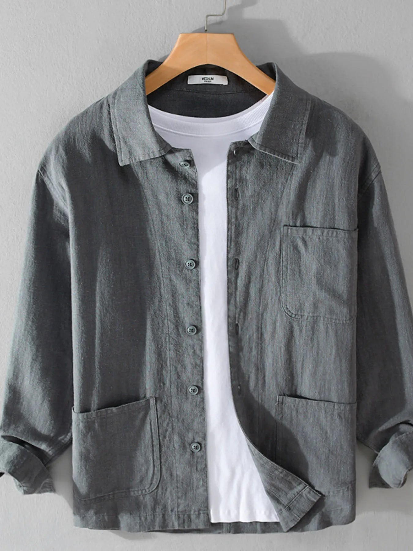 Gray button-up shirt with chest pocket, button front, and long sleeves.