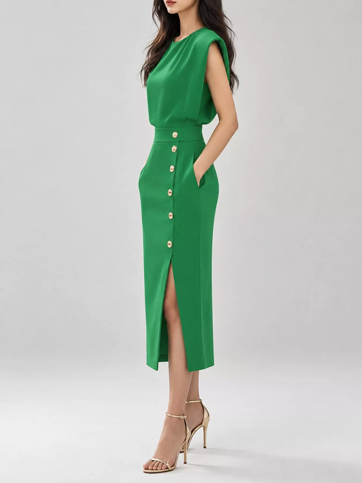 Green sleeveless midi dress with gold buttons and side slit, fitted waist