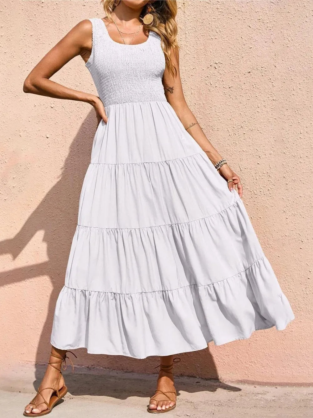 White tiered smocked wide-strap dress, sleeveless with gathered bodice and tiered skirt ruffles.