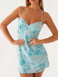 Pastel blue beaded mini dress with floral pattern, spaghetti straps and V-neck