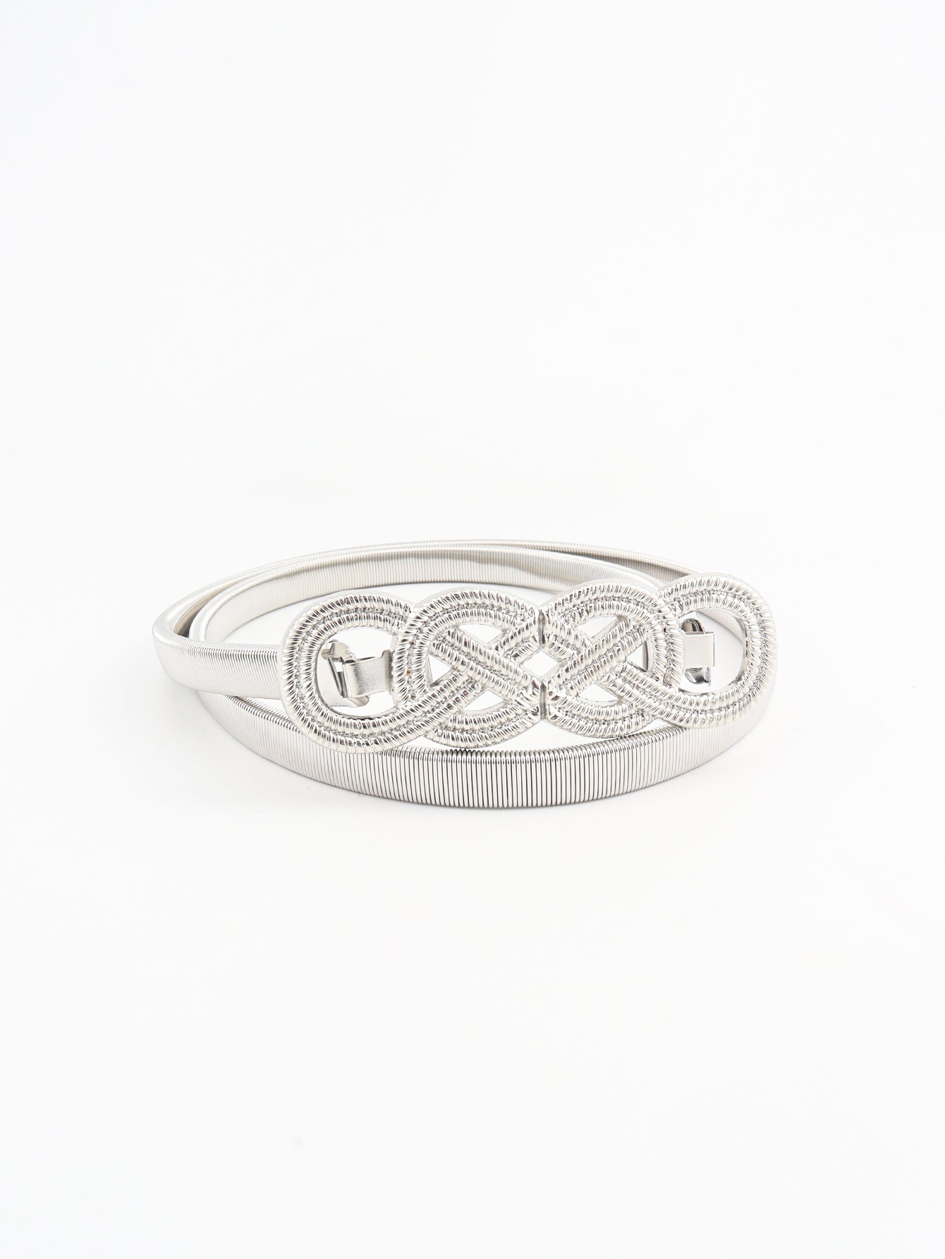 Silver metal knot buckle belt with braided band, flat on background