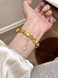 Beaded bracelet with tiger eye beads and gourd charm