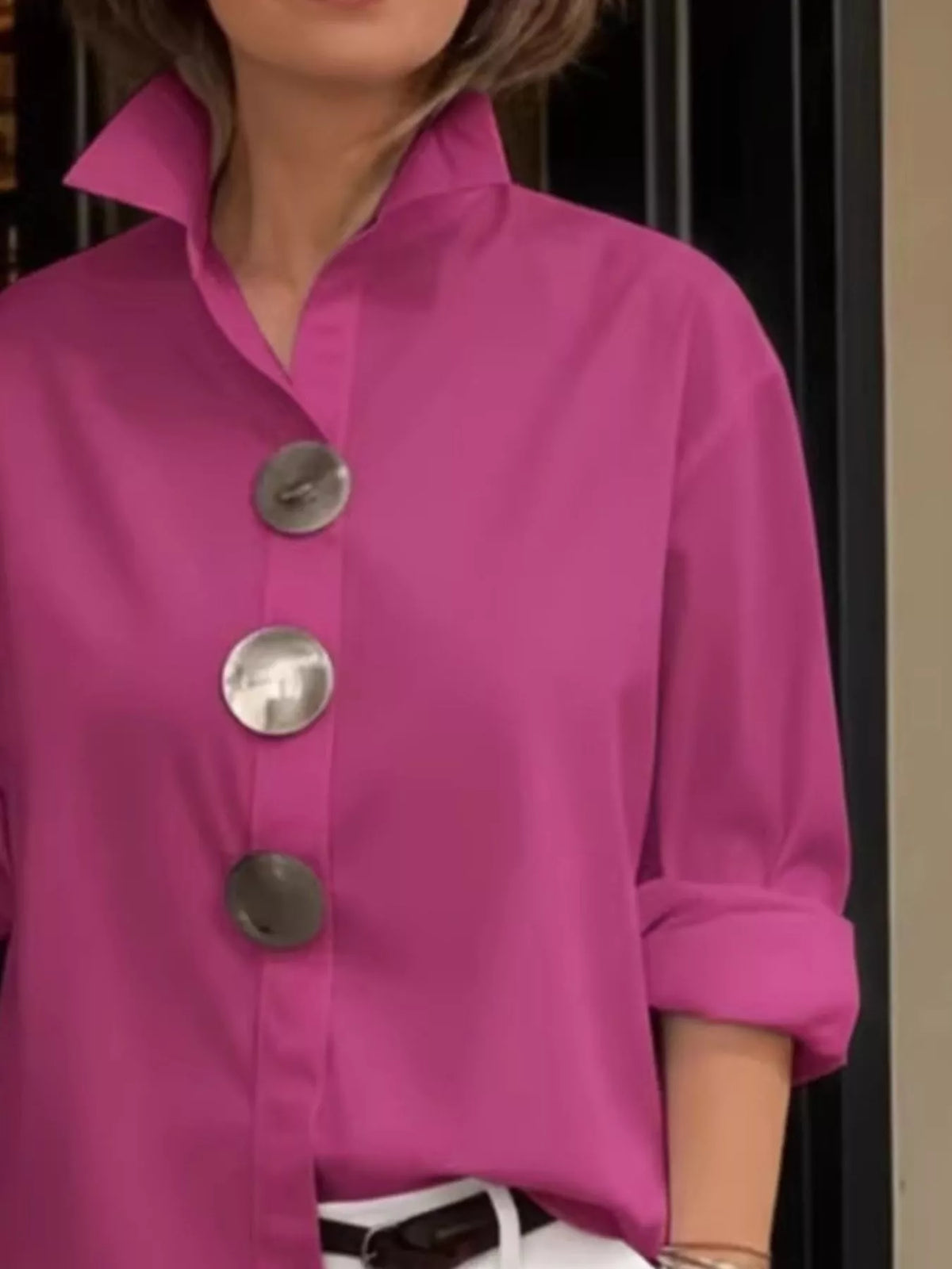 Pink oversized long-sleeve button shirt with metallic round buttons and point collar
