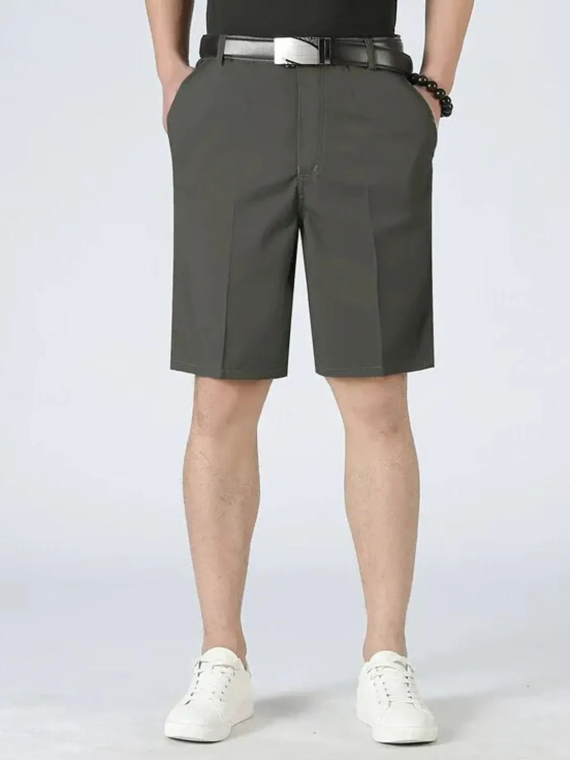 Loose-fit pocketed shorts, dark gray with belt loops and pleated front