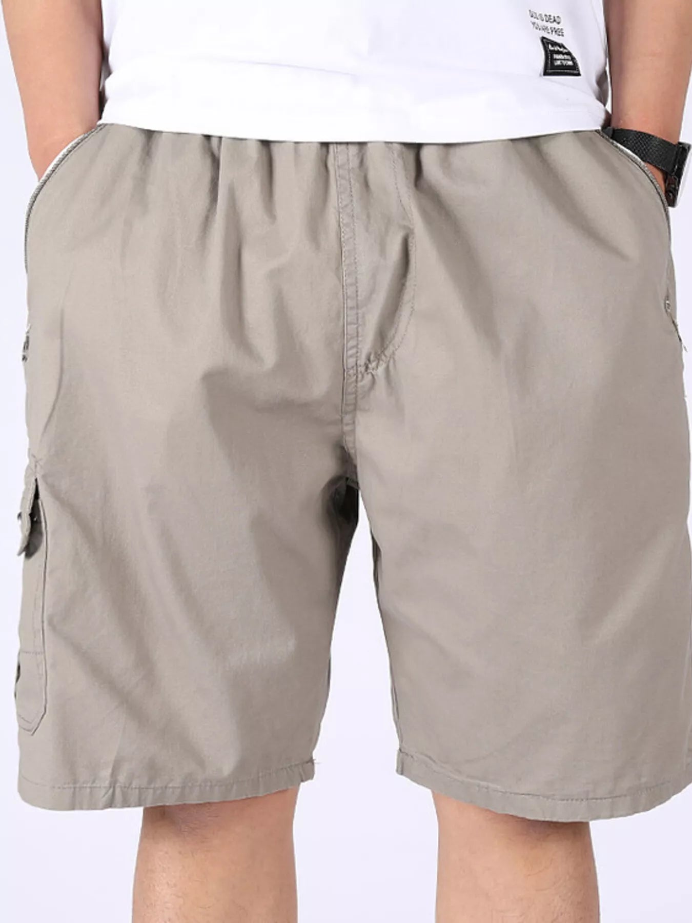 Beige cargo shorts with side cargo pocket and zip fly.