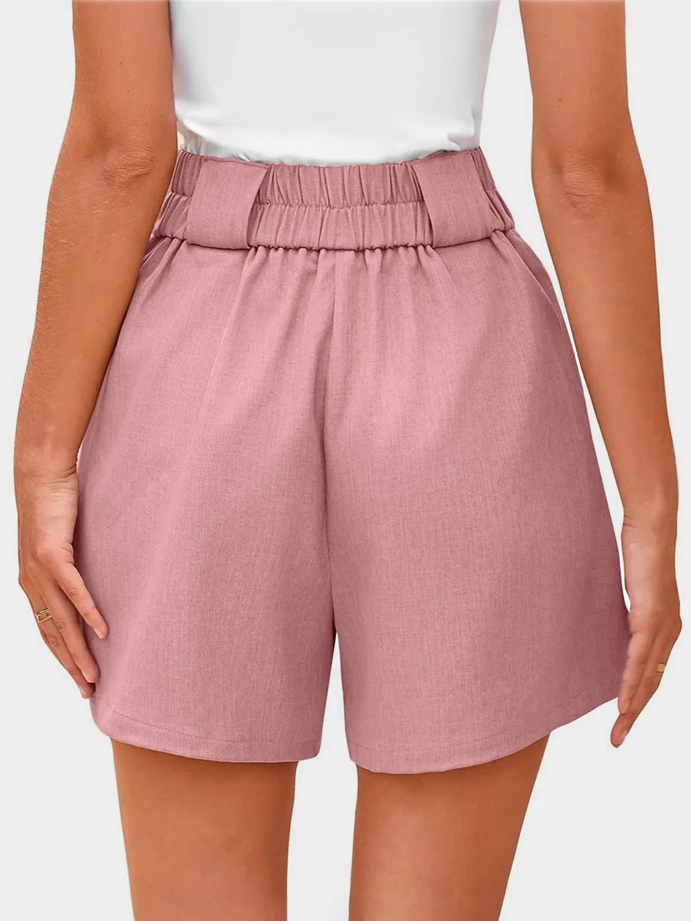 Dusty pink wide-waistband shorts with elastic back waistband and pleats