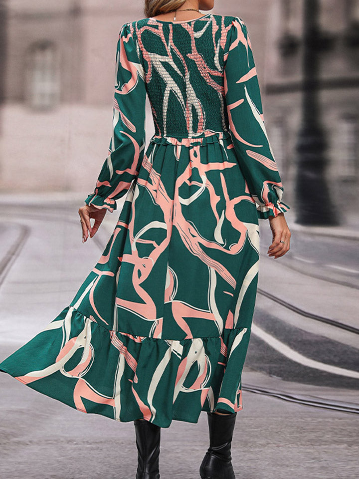 Mid green abstract print smocked waist midi dress with V-neck back and three-quarter sleeves