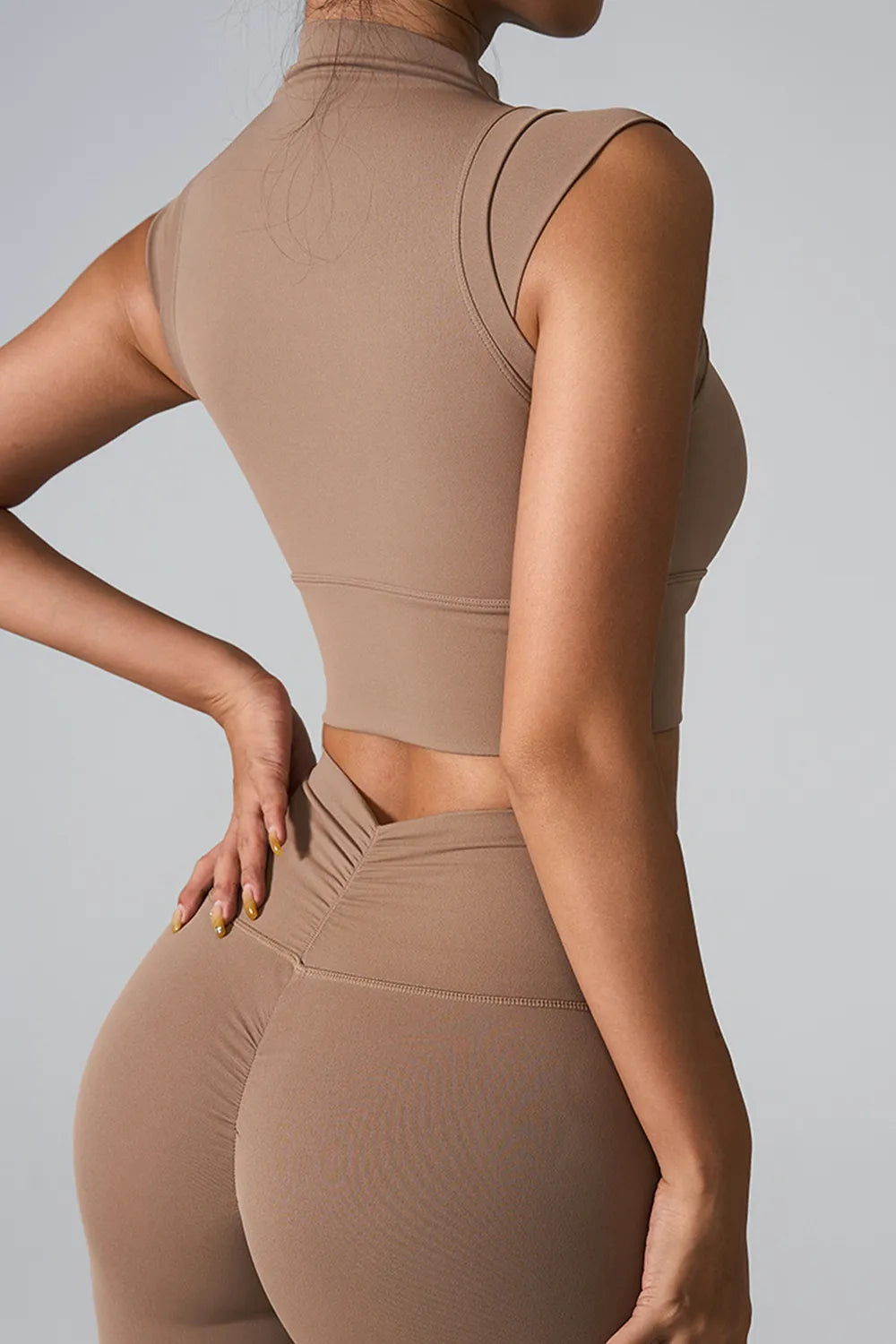 Camel mock neck active tank, sleeveless, fitted back view.