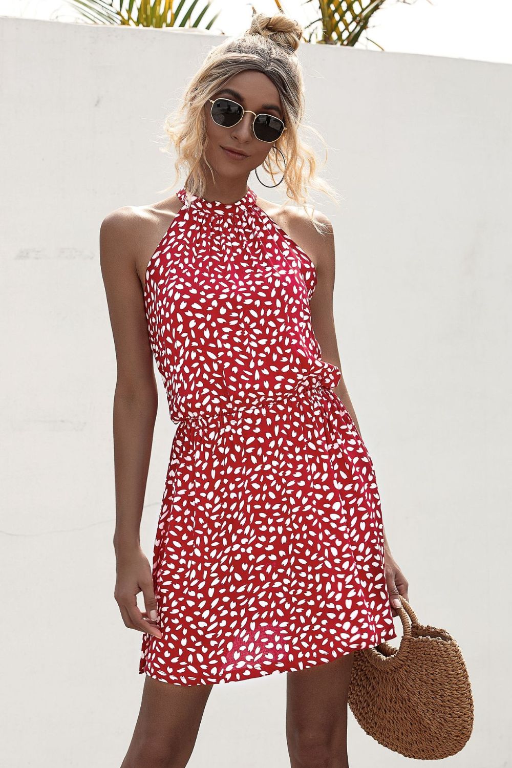 Deep red printed halter mini dress with Grecian neckline and tie waist