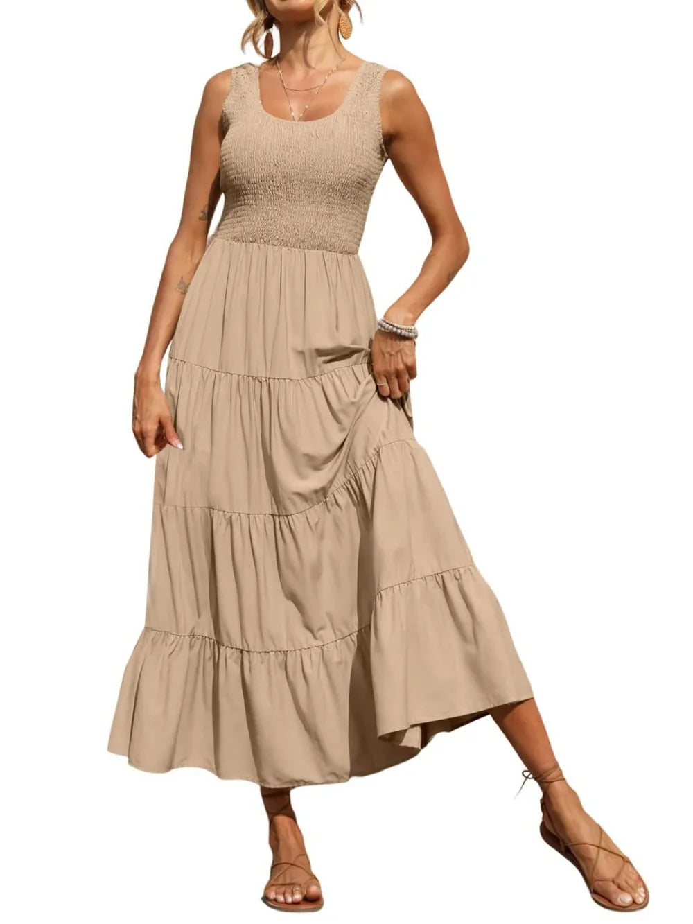 Beige tiered smocked wide-strap dress, sleeveless with gathered bodice and layered ruffle tiers.