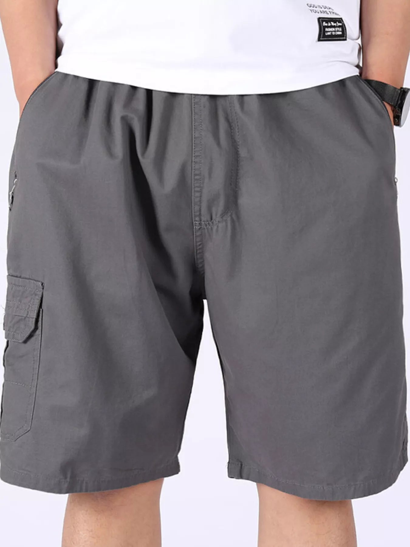 Grey cargo shorts with side cargo pocket, zipper fly and button closure.