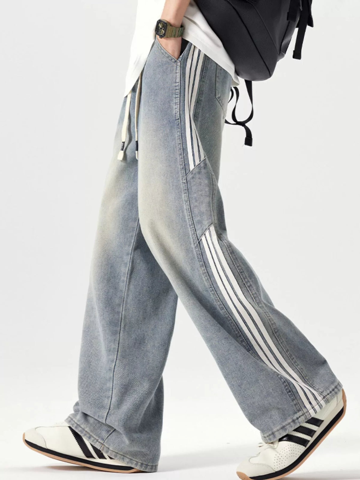 Light blue wide-leg jeans with drawstring waist and drawstring hems, side stripes