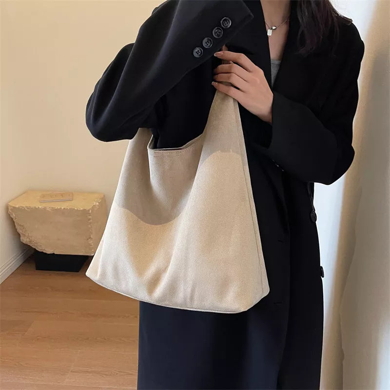 Cream shoulder bag with wide strap and open top