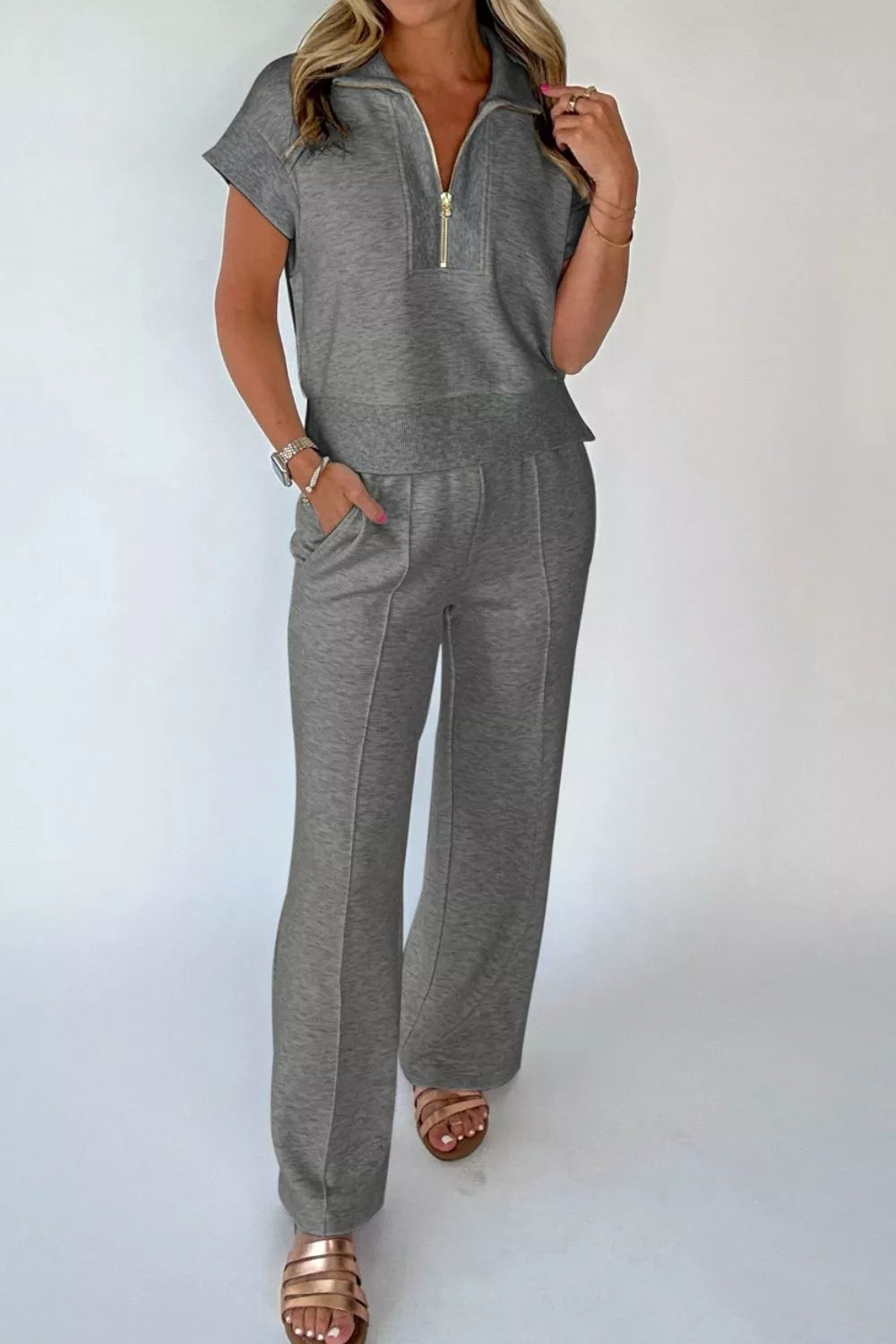 Dark gray half-zip polo tee and matching wide-leg pants set, front view.