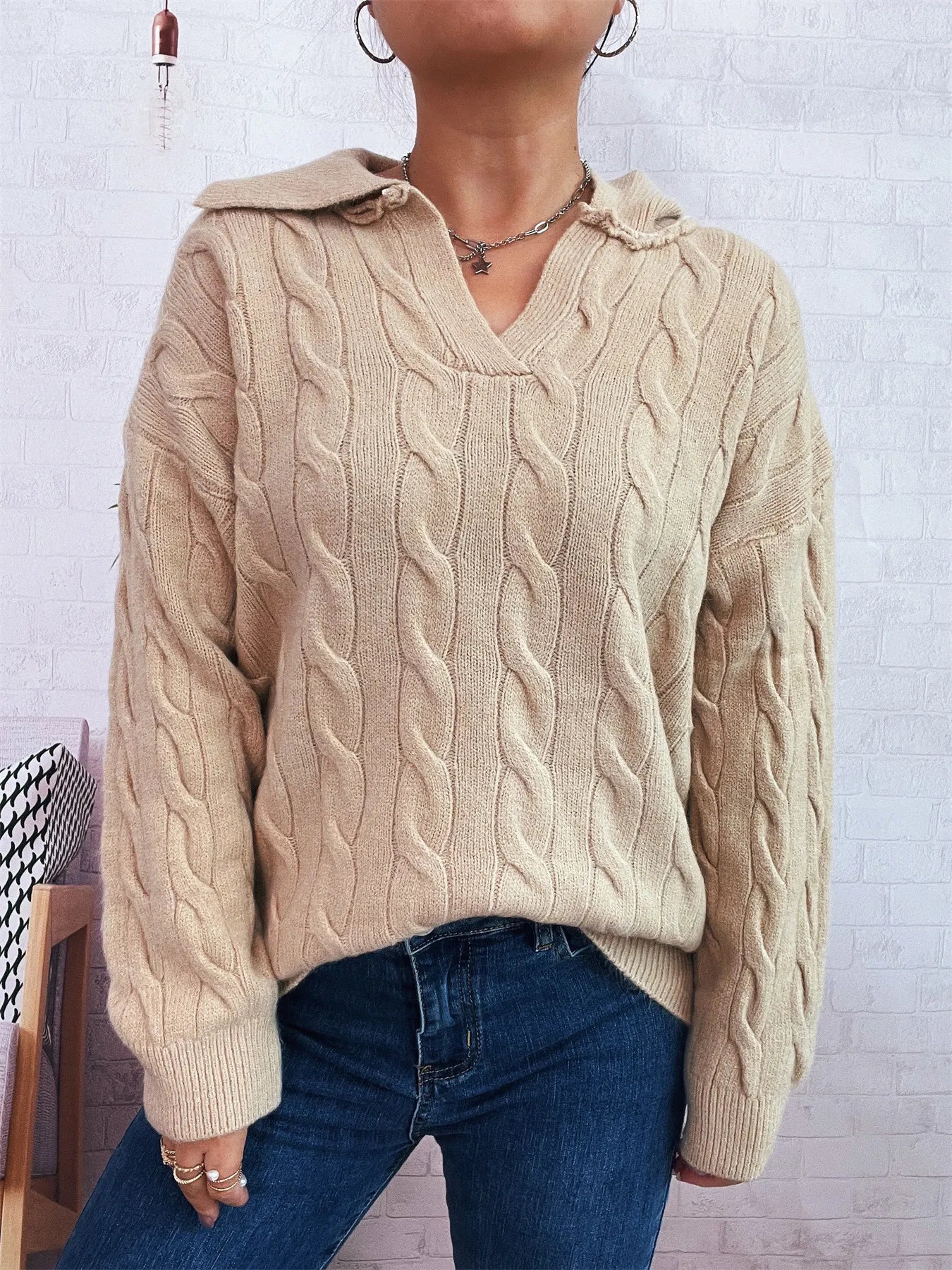Beige cable-knit Johnny collar sweater with V-neck, textured cable pattern, ribbed cuffs
